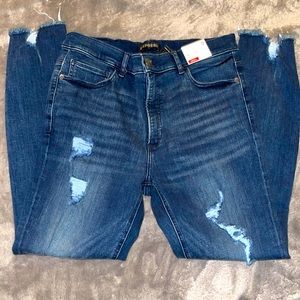 Dark blue, distressed ankle legging skinny jeans.